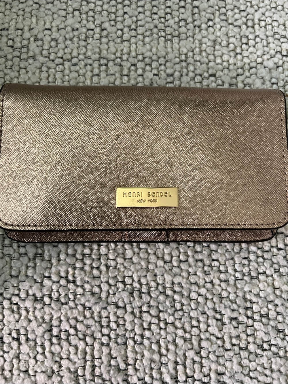 henri bendel metallic rose gold wallet with gold-tone plaque